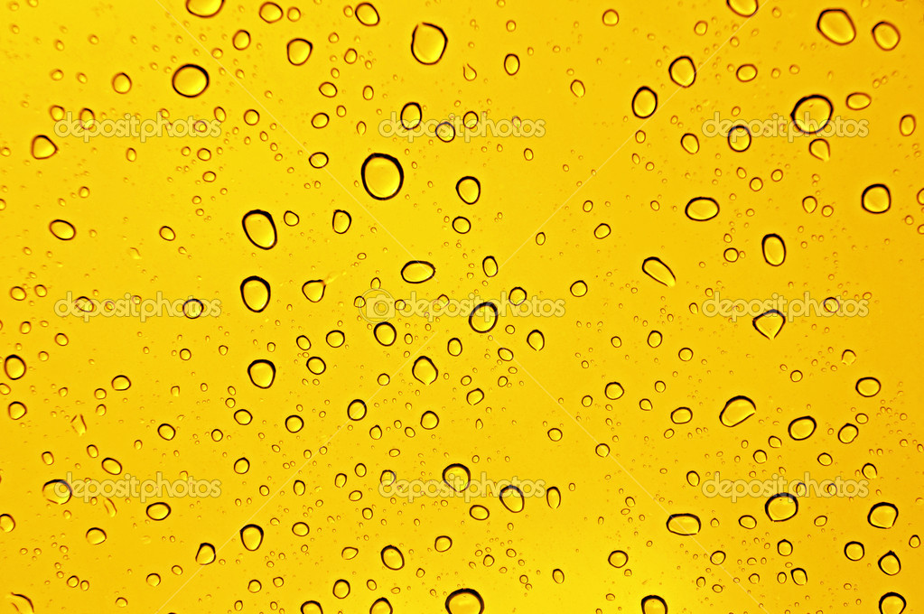 Waterdrops on yellow — Stock Photo © mimiandnanaa 43993469
