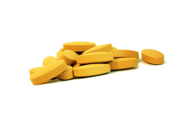 Group of yellow medical pills — Stock Photo, Image