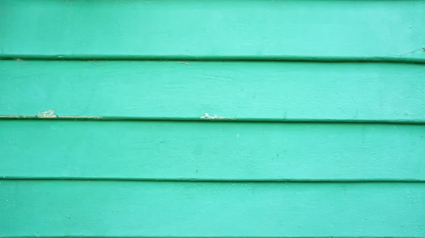 Oude groen geschilderd houten muur - patroon of achtergrond — Stockfoto
