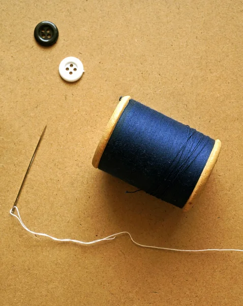 Needle and spools of threads — Stock Photo, Image