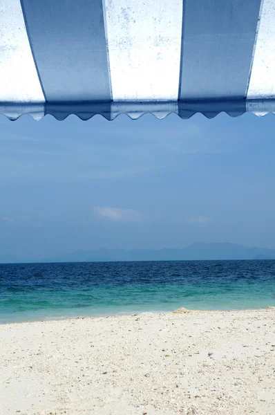 Awning over bright sunny blue sky and beach sea — Stock Image Awning over bright sunny blue sky and beach sea Royalty Free Stock Photos