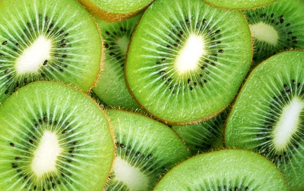 Krásné kiwi plátky ovoce na pozadí — Stock fotografie