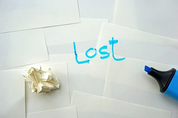 A word "lost" message on white paper — Stock Photo, Image