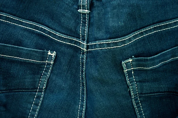 Worn blue denim jeans texture with stitch — Stock Photo, Image