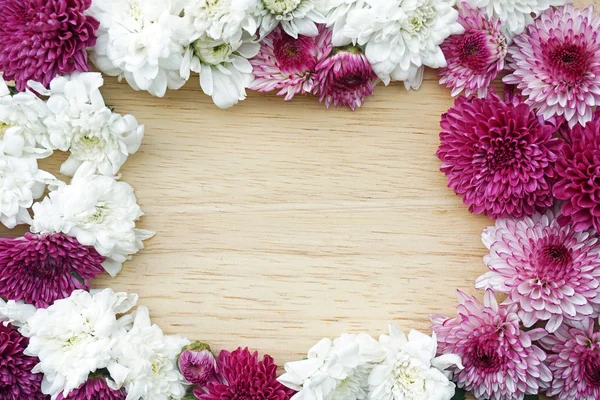 Frame of summer flowers on wooden background — Stock Photo, Image
