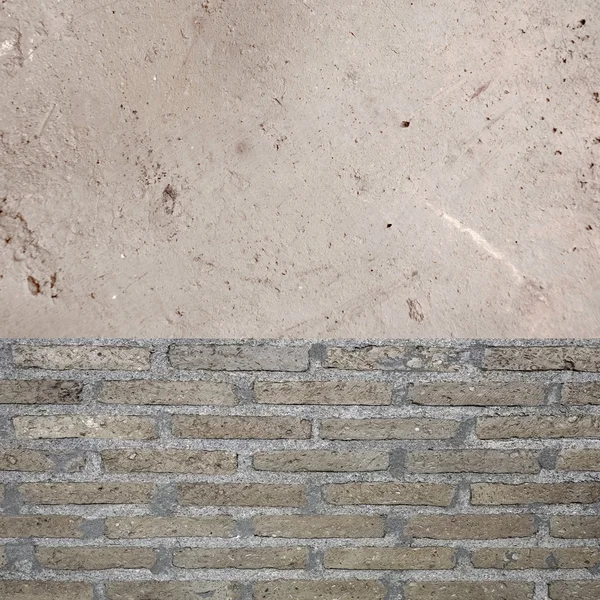 Graue Ziegel und fleckige Zementwand — Stockfoto