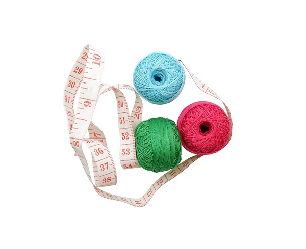 Measuring tape and colorful threads isolated on white — Stock Photo, Image