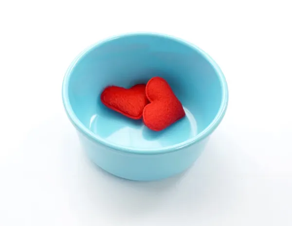 Blue cup and fabric hearts — Stock Photo, Image