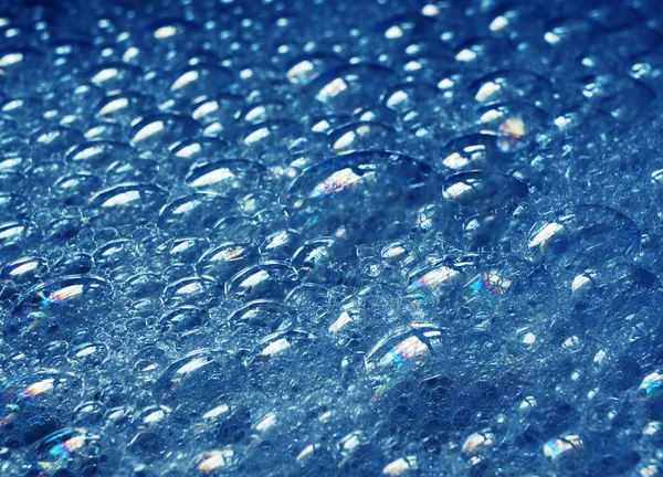 Estrutura de bolhas de sabão em azul — Fotografia de Stock