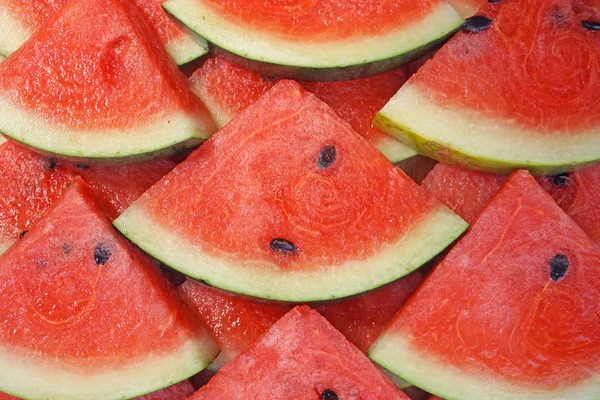 Kousky čerstvé meloun jako pozadí — Stock fotografie
