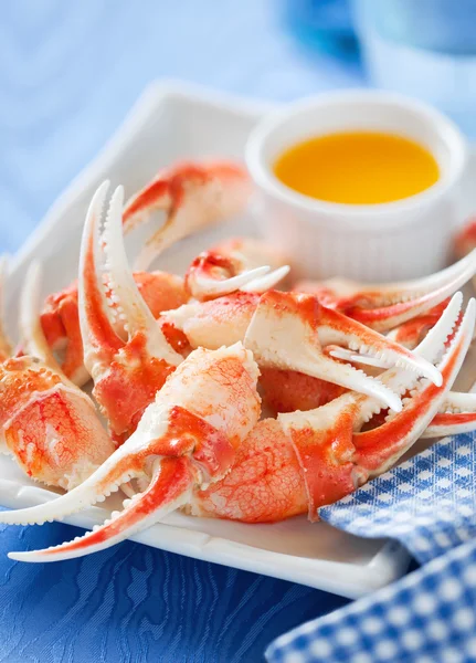 Garras de cangrejo cocidas con salsa de naranja — Foto de Stock