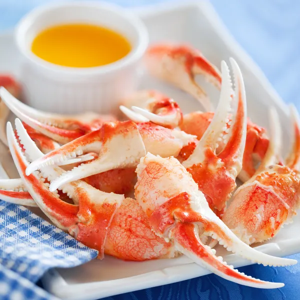 Boiled crab claws with orange sauce — Stock Photo, Image