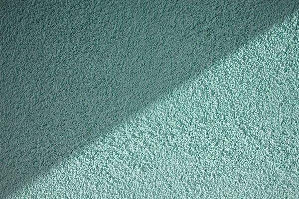 Грубая текстура стенки с диагональной тенью — стоковое фото