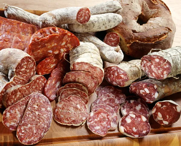 Assortment of different sliced salamis — Stock Photo, Image