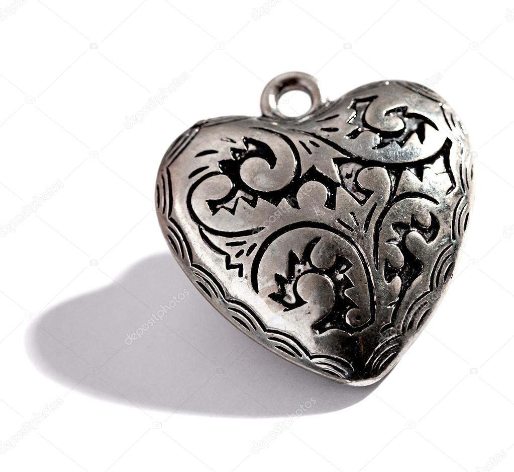 Ornate silver heart shaped locket