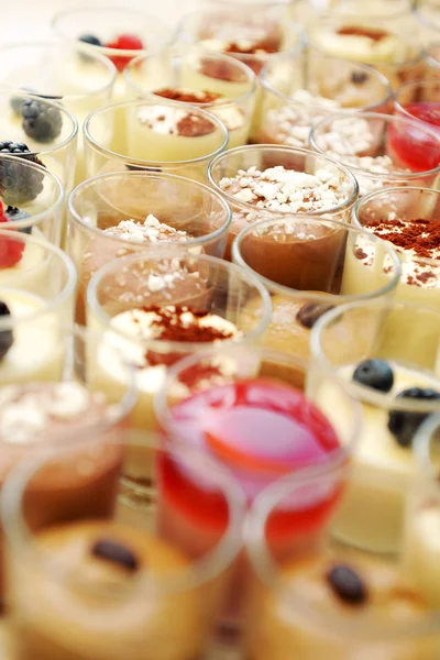 Creamy desserts in glasses — Stock Photo, Image