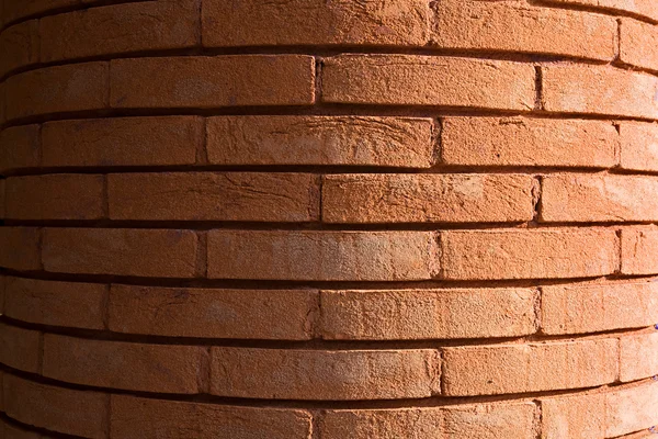 Fondo de una columna hecha de ladrillos de arcilla roja —  Fotos de Stock