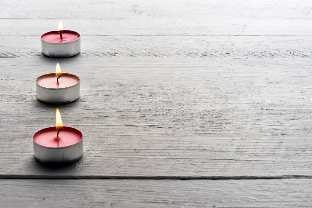 Burning red tealight candles