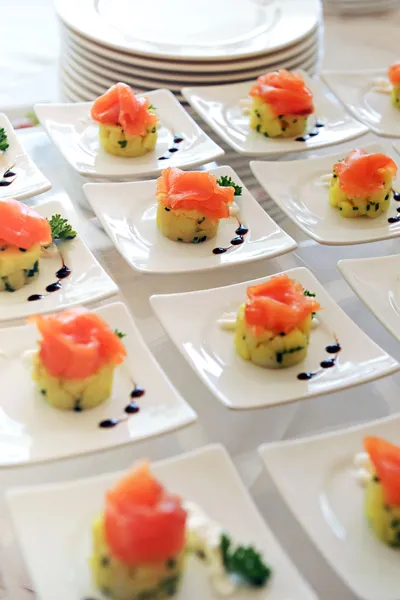 Display of smoked salmon appetizers — Stock Photo, Image