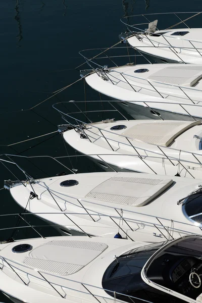 Bows of a row of luxury motorboats — Stock Photo, Image