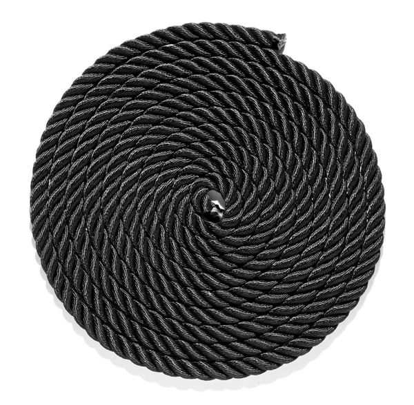 Neatly coiled braided plaited black rope — Stock Photo, Image