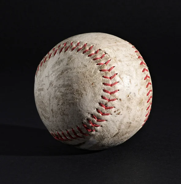 Leather baseball on black with stitching detail — Stock Photo, Image