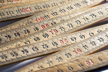 Background of wooden meter rulers clipart