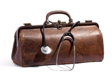 Old brown leather doctors bag and stethoscope
