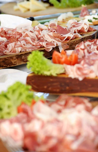 Variety of salami and ham on a buffet — Stock Photo, Image