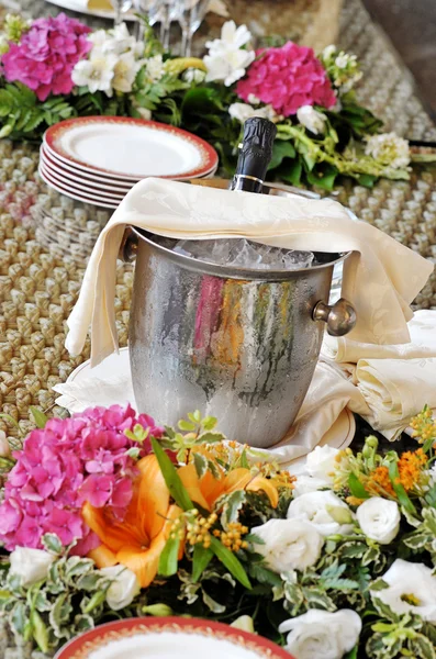 Champagne chilling in a silver ice bucket — Stock Photo, Image