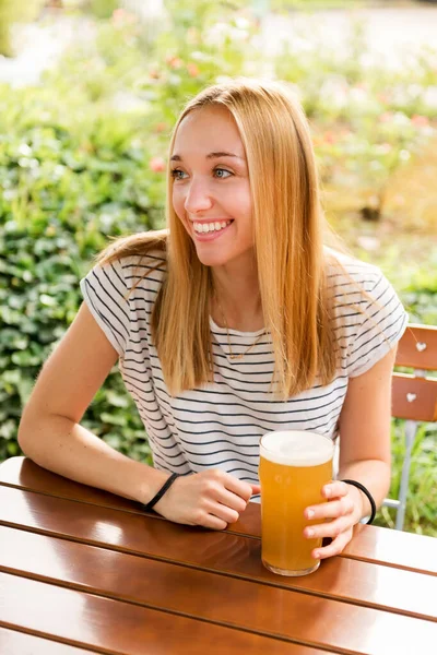 Positive Young Blond Haired Female Casual Outfit Sitting Wooden Table — Foto Stock