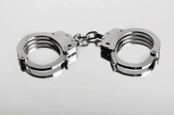 Studio Close Locked Pair Hiatt Type Handcuffs Mirrored Shiny Surface — Stock Photo, Image