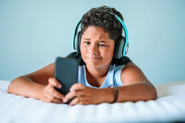 Disappointed Ethnic Boy Dark Curly Hair Modern Headphones Playing Video — Stock Photo, Image
