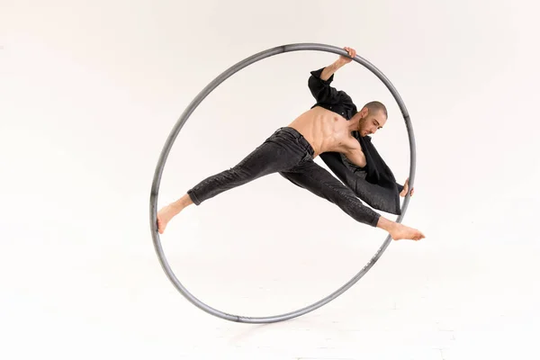 Circus Acrobat Doing One Leg Trick Spinning Cyr Wheel Isolated — Stok fotoğraf