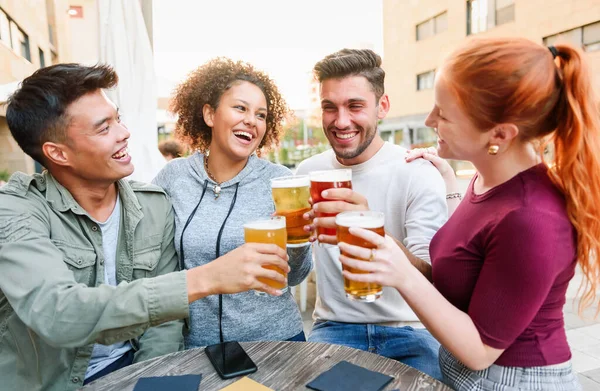 Positive Multiethnic Friends Clinking Glasses Beer Looking Each Other While — Fotografia de Stock