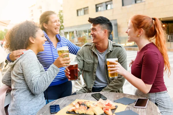 Happy Woman Laughing Embracing Diverse Friends Beer Sitting Pub Table — Stock fotografie