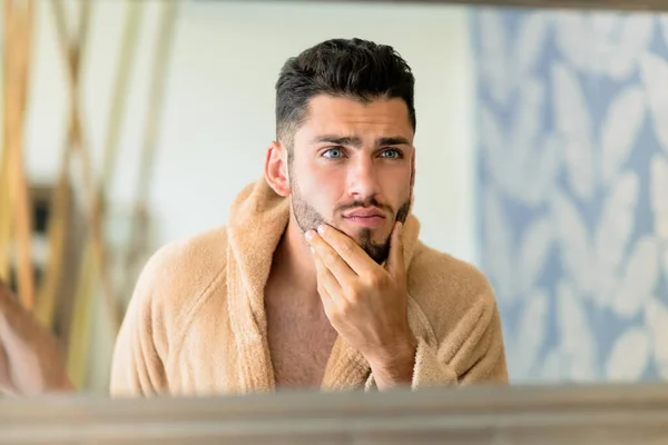 Young Male Warm Bathrobe Touching Beard Looking Mirror Skin Care — ストック写真