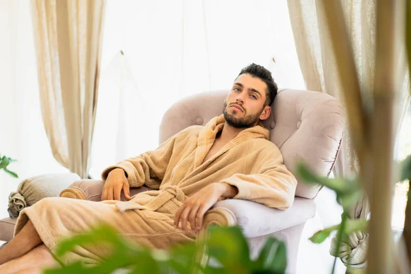 Bearded Young Male Client Soft Bathrobe Looking Camera While Chilling — ストック写真