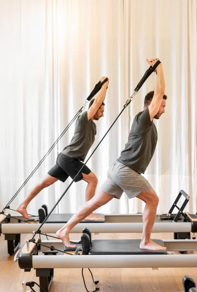 Full Body Side View Sportive Men Doing Pilates Saute Exercise — Zdjęcie stockowe