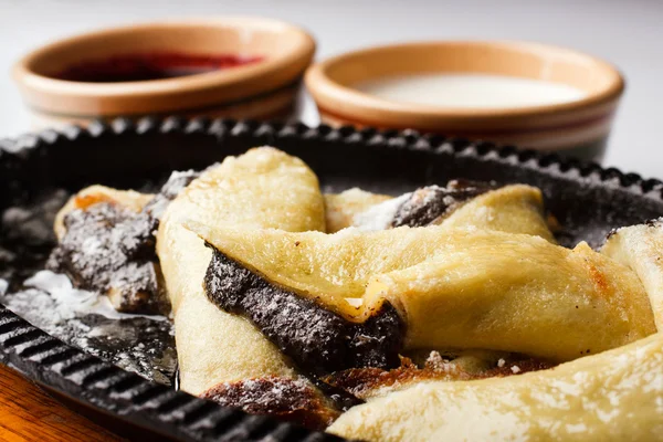 Pancakes with poppy seeds and nuts with sour cream and cherry ja — Stock Photo, Image