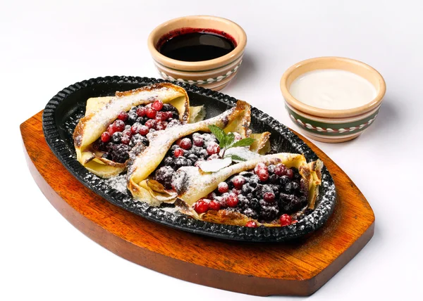 Pancakes with sour cream ,berries and cherry jam — Stock Photo, Image