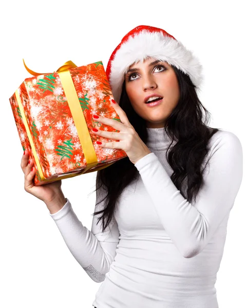 Mooi meisje in de hoed van de kerstman met een cadeau — Stockfoto