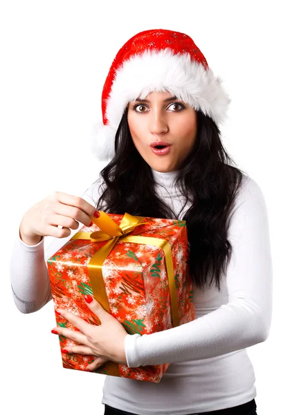 Beautiful girl in the hat of Santa Claus with a gift — Stock Photo, Image