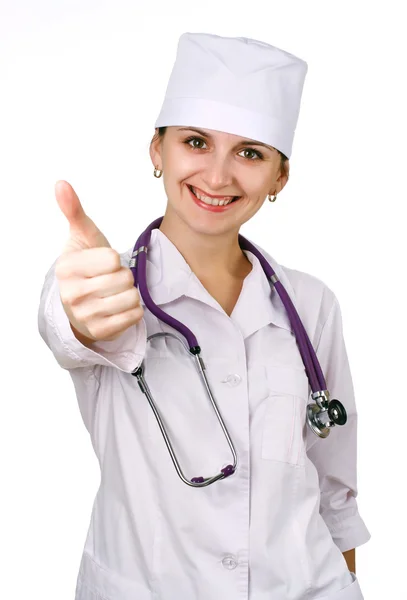 Charming woman doctor shows the thumb — Stock Photo, Image