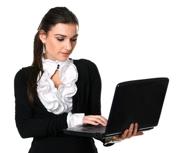 Beautiful brunette in a business style with a laptop — Stock Photo, Image