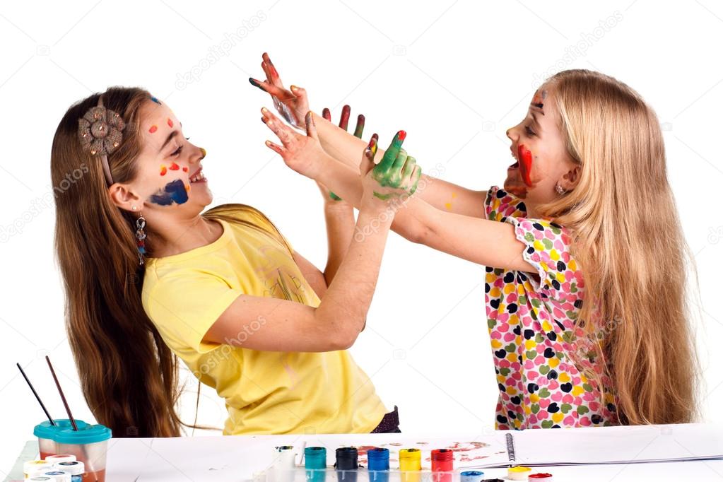 girls paint each other's colors