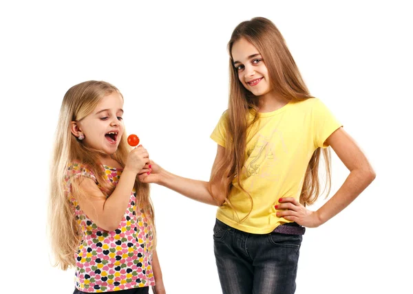 Two girls with candy — Stock Photo, Image