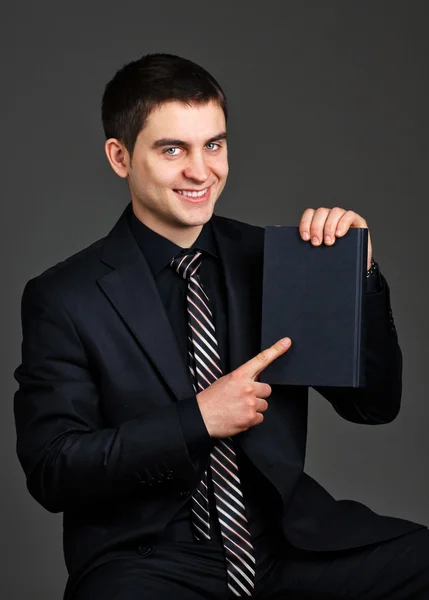 Biznesmen z notebookiem — Zdjęcie stockowe