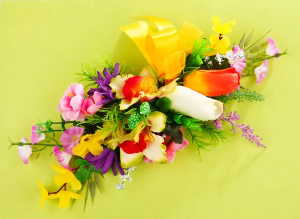 Floral arrangement on a yellow background — Stock Photo, Image