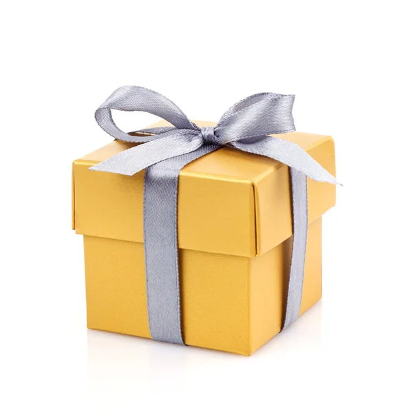 Golden gift box with silwer ribbon — Stock Photo, Image